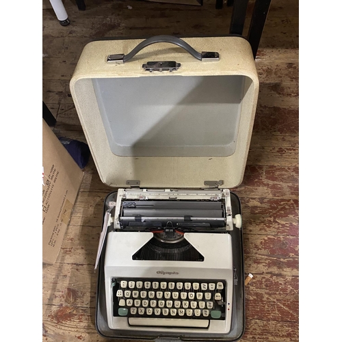 195 - A vintage Olympia portable typewriter, shipping unavailable