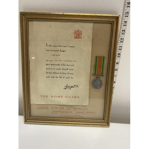 18 - A WW2 home guard certificate and defence medal, framed