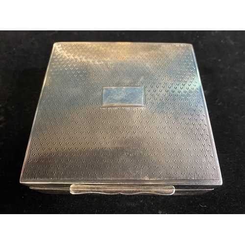 212 - A hallmarked silver Art Deco period cigarette box with boxwood lining