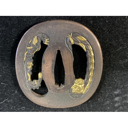 220 - A 18th century Japanese Tsuba sword guard with gilt decoration