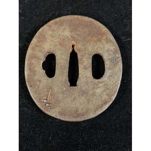 224 - A 18th century Japanese iron Tsuba sword guard with decoration