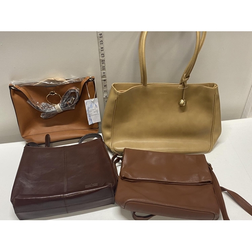 315 - A selection of new ladies including leather handbags