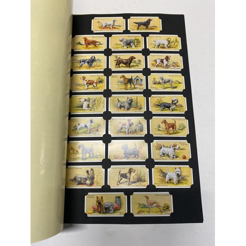 347 - A card collectors society folder full of reprint cigarette cards