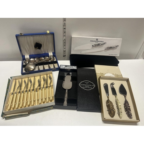 42 - A selection of cased cutlery including Laura Ashley and a new international silver company cake slic... 