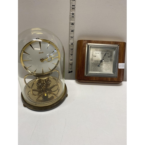 7 - A vintage glass dome case Kundo clock and a barometer