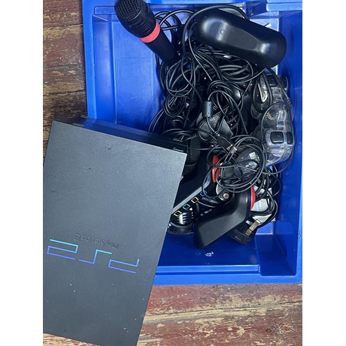 77 - A PS2 console and accessories