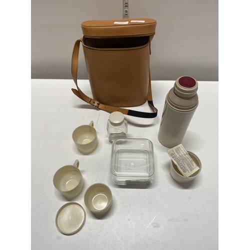 173 - A vintage cased Thermos picnic set