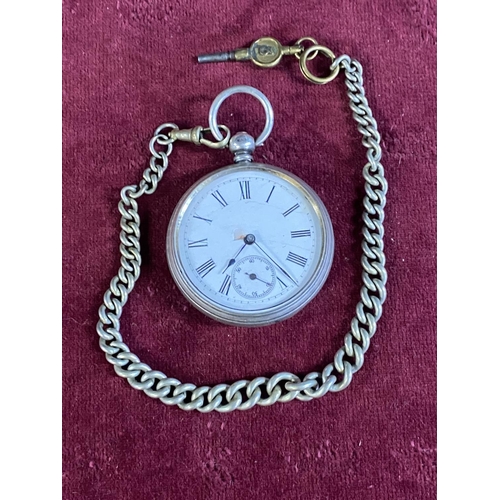 111 - A hallmarked silver gents pocket watch with chain and key (slight damage to enamel dial runs intermi... 