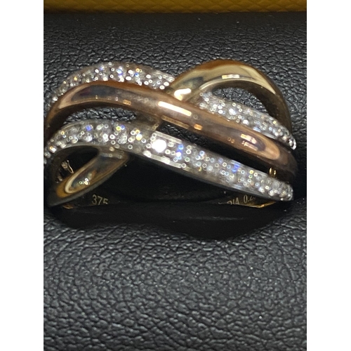 113 - A 9ct gold ring with diamond accents 3.75 grams