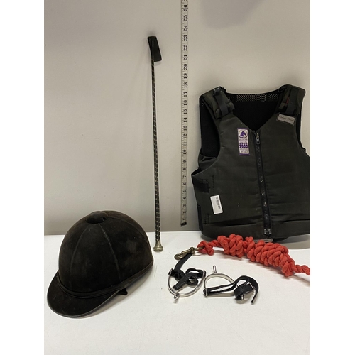 131 - A selection of horse riding safety equipment etc including crop