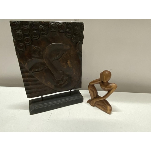 186 - A hand carved wooden Budda plaque and one other