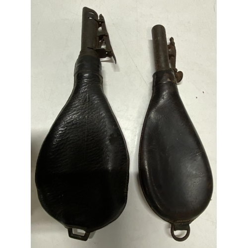 187 - Two early leather military powder flasks