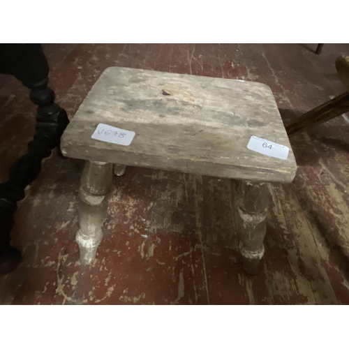 64 - A antique wooden four legged stool.