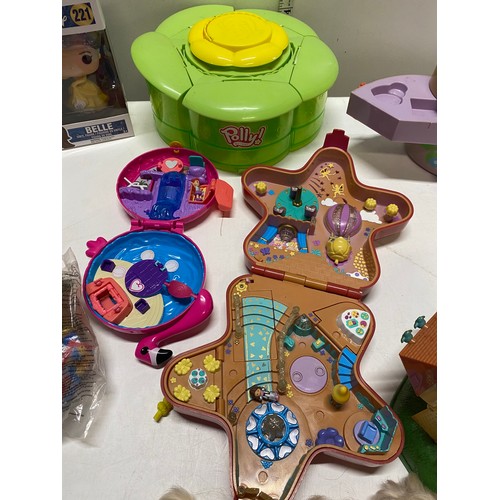 58 - A box of Polly Pockets, and other toys