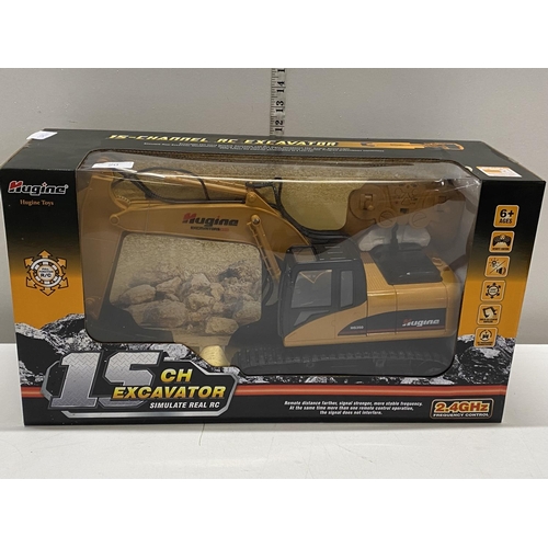 20 - A new boxed Hugine remote control excavator