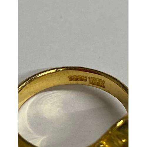 122 - A hallmarked Chinese 22ct gold and Jade stone solitaire ring. 7.36 grams. Size N 1/2.