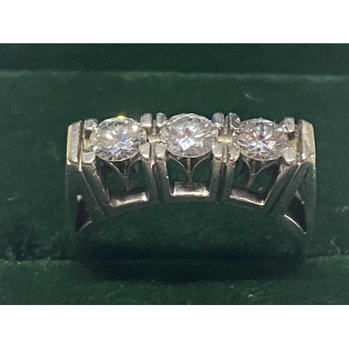 253 - A 18ct gold and three stone diamond ring with round brilliant cut diamonds approx over 1ct of diamon... 