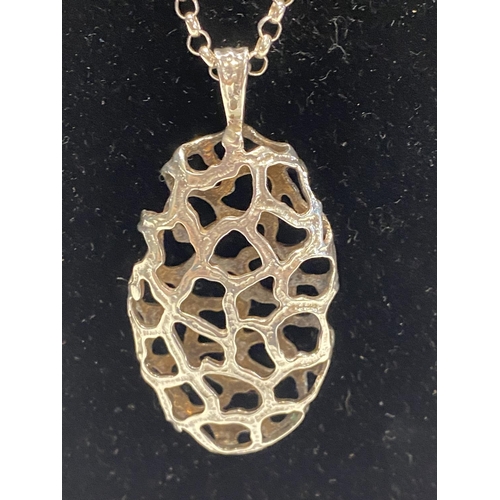 242 - A 925 chain and white metal pendant