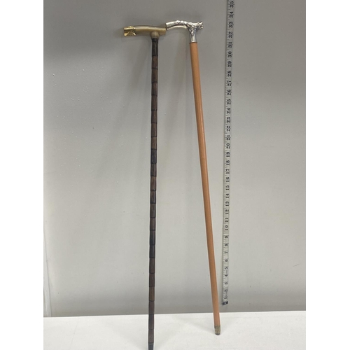 307 - Two vintage walking canes one with horn and gilt metal handle and the other with a hallmarked silver... 