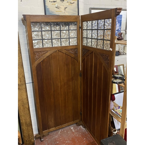 396 - A antique clerics privacy screen with glazed and carved panels, shipping unavailable