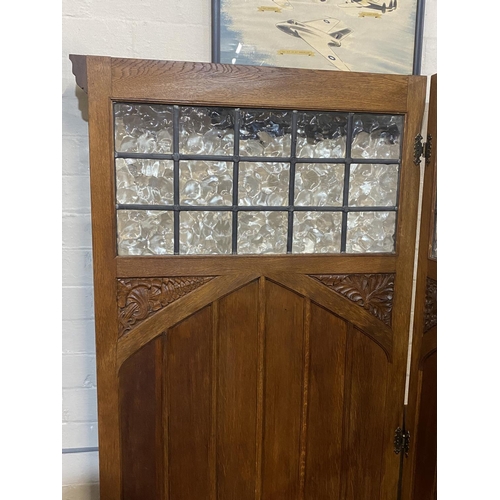 396 - A antique clerics privacy screen with glazed and carved panels, shipping unavailable