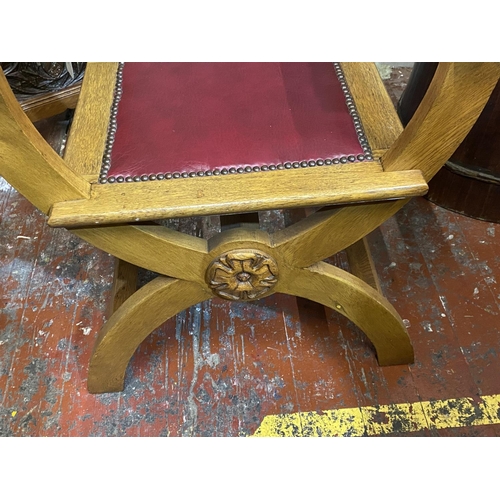 397 - A antique X framed oak bishops chair with red leather insert, shipping unavailable