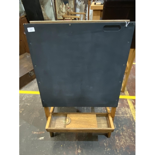 400 - A 1940/50 child's wooden folding chalkboard, shipping unavailable