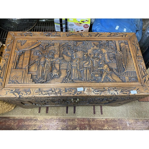 82 - A early 20th century large Chinese hand carved camphor wooden chest with quality relief carving 104x... 