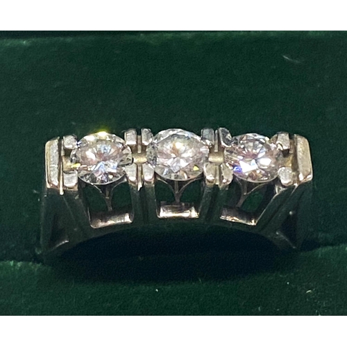 116 - A 18ct gold and three stone diamond ring with round brilliant cut diamonds approx over 1ct of diamon... 