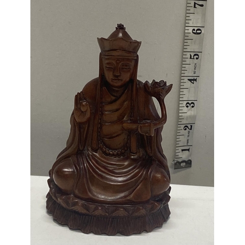 221 - A hand carved wooden Budda figure