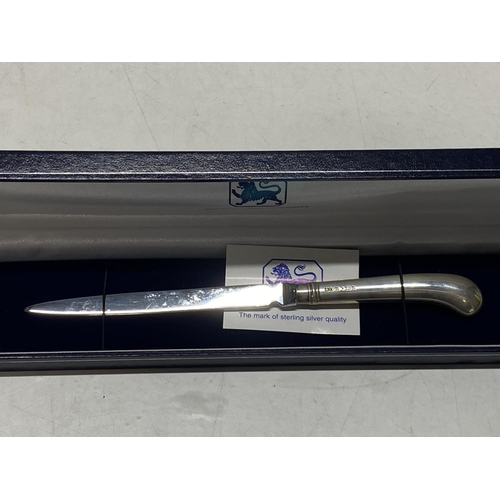 110 - A hallmark silver handled paper knife