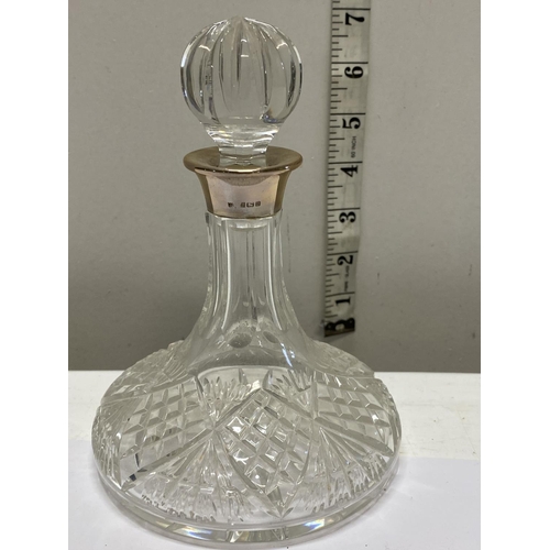 112 - A hallmarked silver collared small decanter