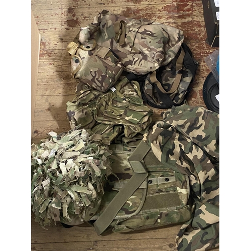 205 - A helmet and military camouflage accessories including back pack etc