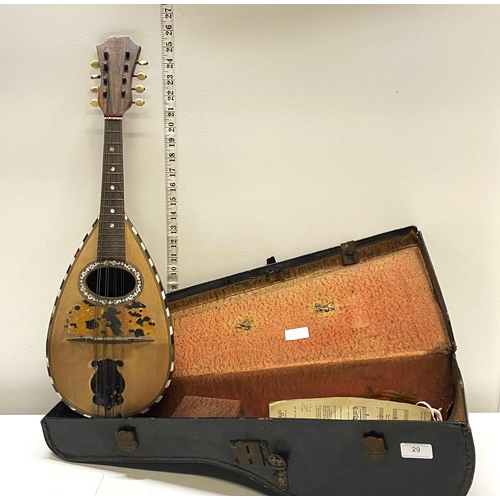 29 - A early 20th century cased Marco Rebora mandolin with inlay detail