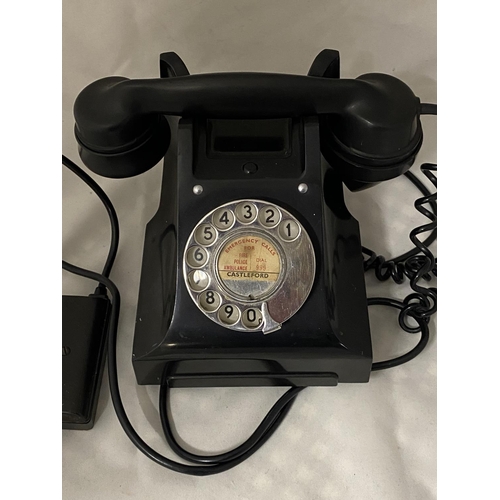 41 - A vintage Bakelite telephone