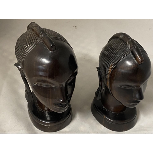 42 - Two carved wooden African busts and a small wooden basket