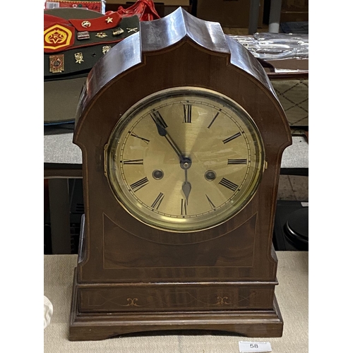 58 - A mahogany cased mantle clock with brass dial