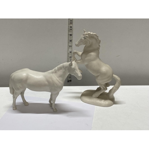 63 - Two Beswick white horses