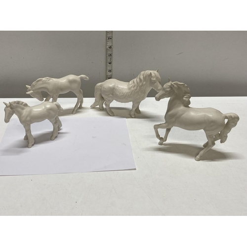 65 - Four Beswick white ceramic horses