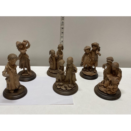 66 - Six assorted resin figures on wooden bases