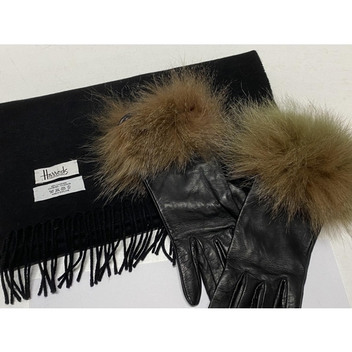 126C - A Harrod's cashmere scarf and a pair of ladies leather and fur gloves