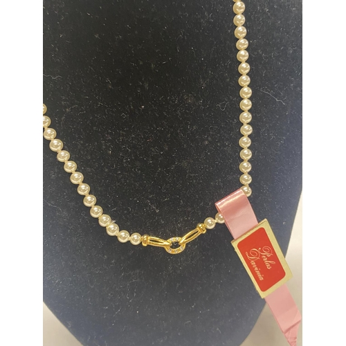 332 - A string of simulated pearls with 14ct gold fittings