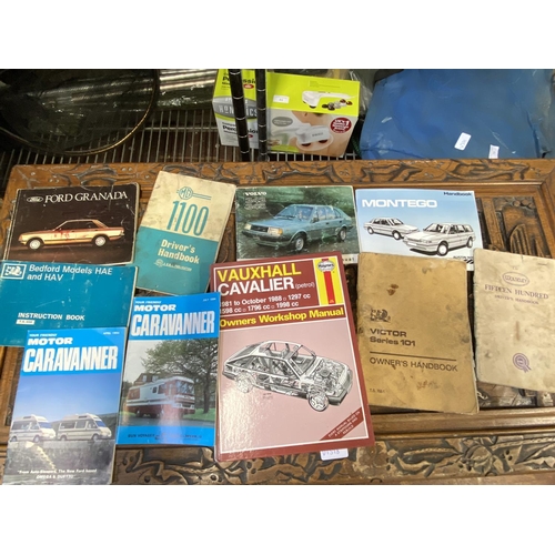 310 - A box full of assorted vintage car manuals