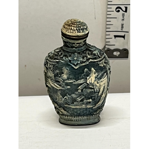 320A - A cinnabar carved Chinese snuff bottle
