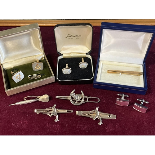 355 - A selection of assorted costume jewellery cufflinks and tie-clips including Selfridges and Masonic