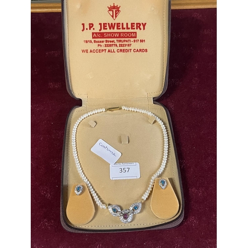 357 - A vintage cased costume jewellery earrings and necklace set
