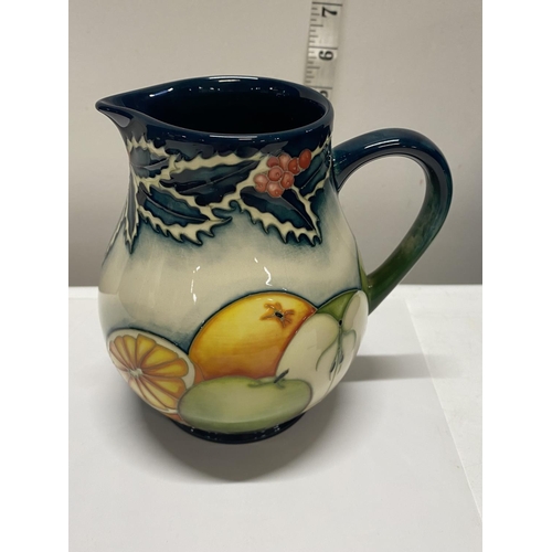 116 - A boxed limited edition Moorcroft jug 10/20 entitled 'Festive Fruit' by A Davenport h15cm