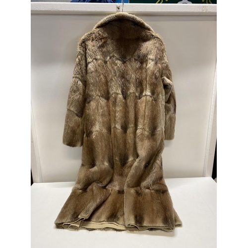 342 - A very good quality handmade reversible fur coat/mac, with unusual patterned pelts (poppers need att... 