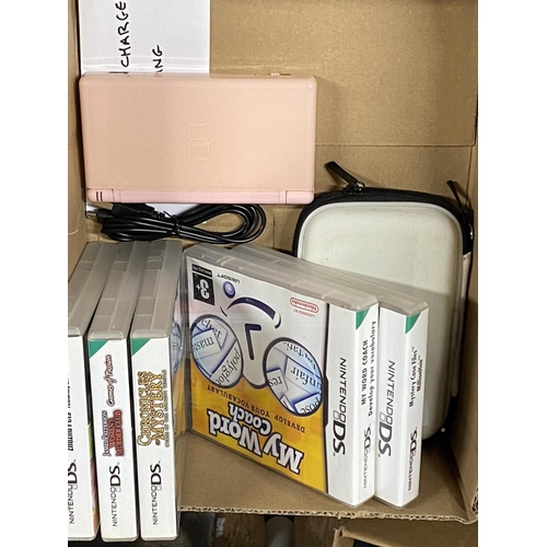 49 - A Nintendo DS with selection of games and charger in working order