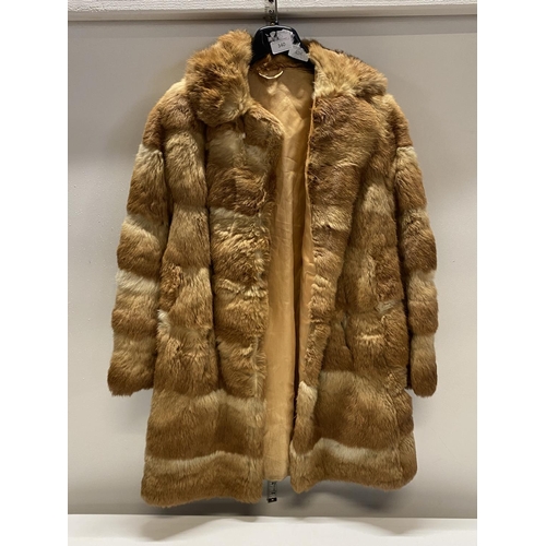 340 - A ladies fur coat, no size slight tear